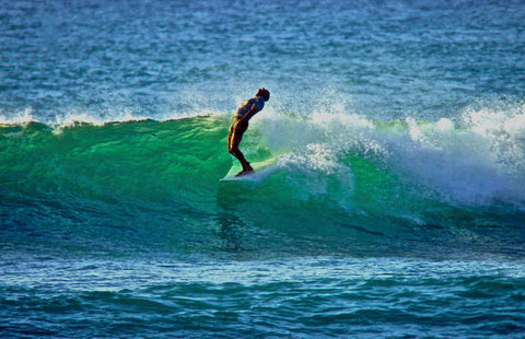 Person surfing on a wave in the ocean.  Shot in San Diego, California. © Randy Dible Photo